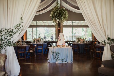 Hill country wedding ceremony with floral arch