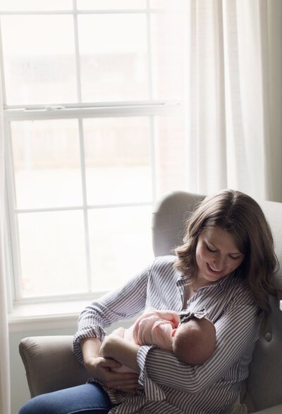 Woman rocking baby
