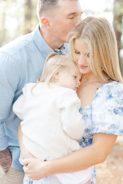 Sammie with her husband and daughter