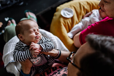 A newborn baby girl relaxed after nursing