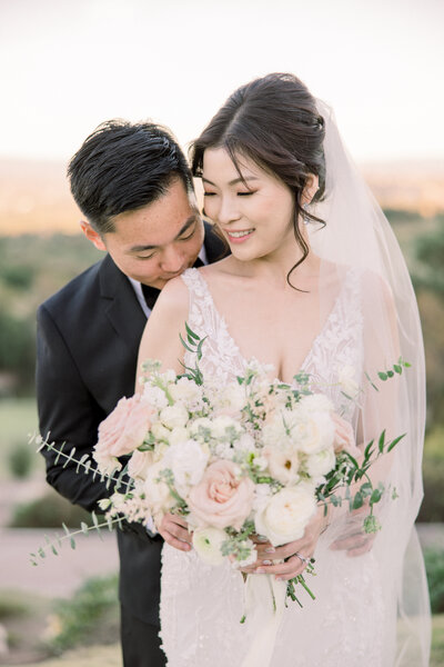 Fine art wedding photography of bride and groom during golden hour
