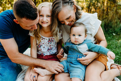family of four snuggling by lancaster pa family photographer