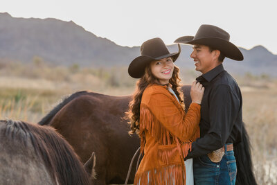 Monterey county cowboy and cowgirl with their horses