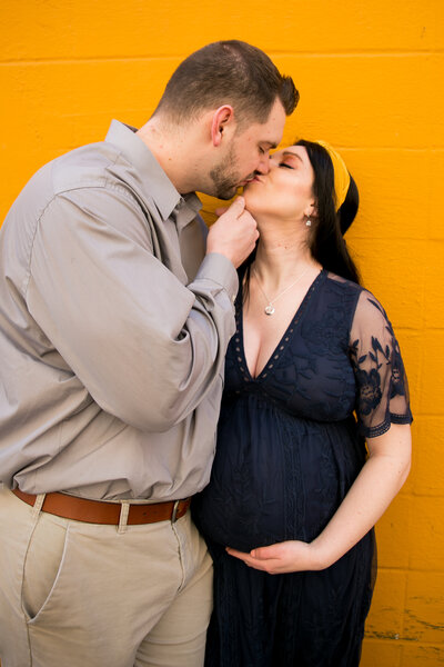Husband and wife kissing | Taken by Maine Maternity Photographer