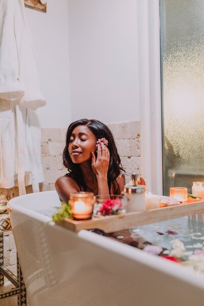 A woman indulges in a tranquil bath experience