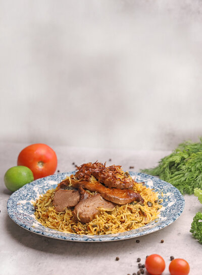 a cooked goat dish with rice