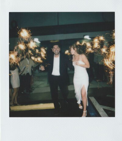 Polaroid of bride and groom sprinkler exit by luxury destination wedding photographer Noble Photo Co