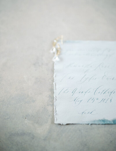 ethereal light blue handmade paper wedding invitation, soft stationery with gold earrings, Mediterranean wedding
