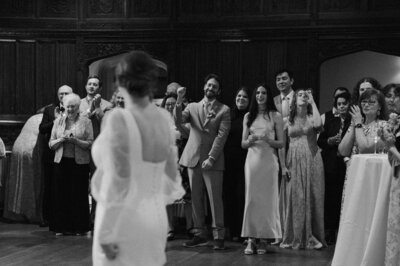 Kellen and Paul sharing a toast during their wedding reception in New York City.