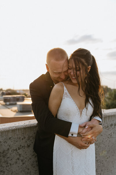 close up of groom touching brides arm  taken by fargo wedding photographer kiella lawrence