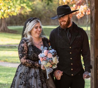 Wedding Photographer captures couple smiling walking down the aisle