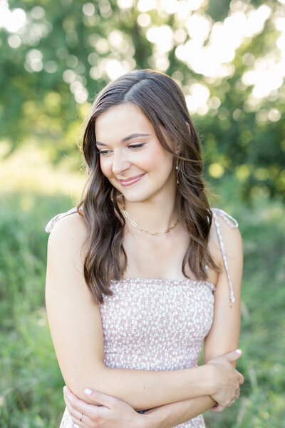 Senior girl looking at the camera on a summer evening.