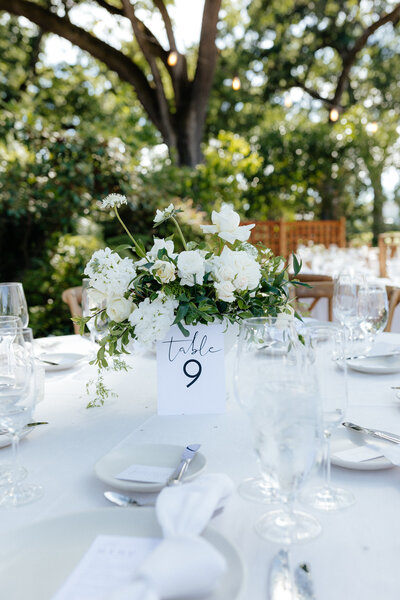 Wedding and Elopement Photography, cake display table with floral arrangement