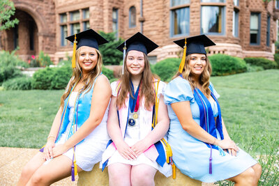 3 SLU seniors in front of the Cupples house on saint louis university campus