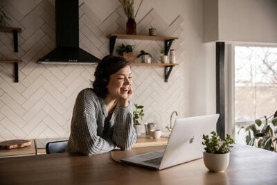 Woman doing a virtual therapy appointment on her laptop