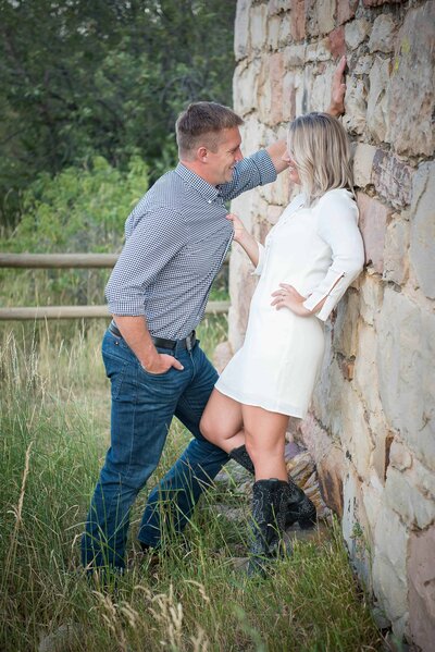 a women pulling her man in for an engagement session in Boulder, Colorado