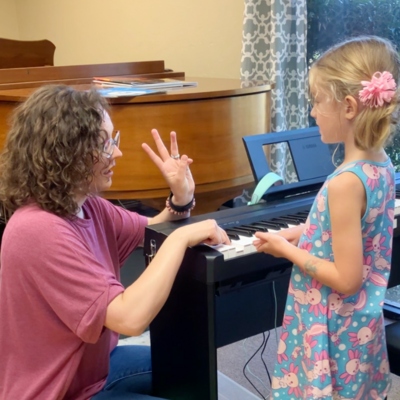Infant playing music in Mommy and Me Class in Edmond Oklahoma