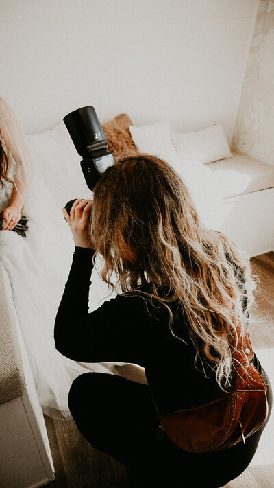 Photo of a girl closing her eyes while holding her cheeks