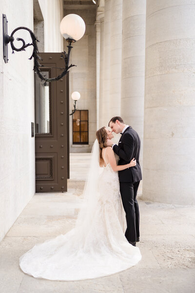 A bride and groom laugh as they exit their wedding ceremony