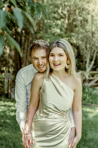 Lavender Turner and Tim, a couple of photographers, are pictured smiling happily together.