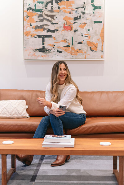 Individual therapist in Raleigh sitting on couch