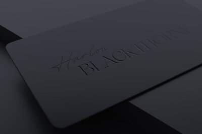 Black embossed business cards for an author