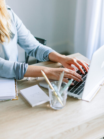 Interior-Design-Assistant-Working-on-Laptop