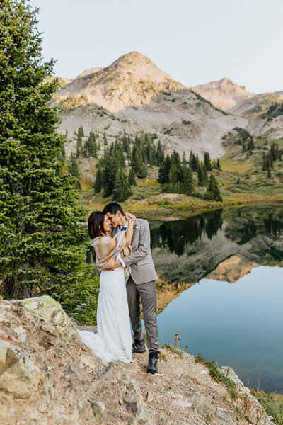Bride and groom embracing each other in the stunning landscapes of Crested Butte, Colorado, during their adventure elopement, capturing an intimate and emotional moment.