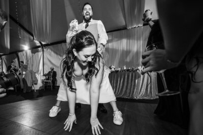bride-and-groom-during-reception-laughing-dancing-wild-wedding-night