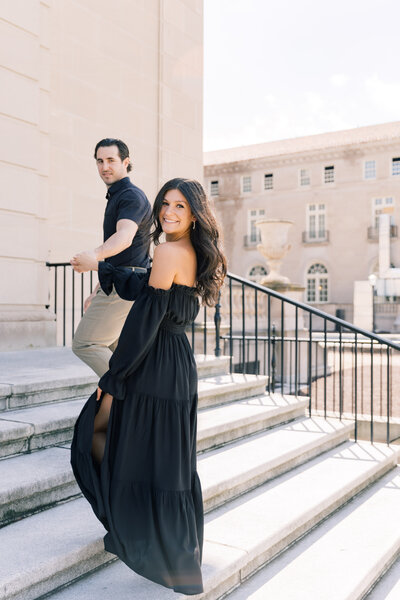 Bride and groom walking up stairs during engagement session in Hershey