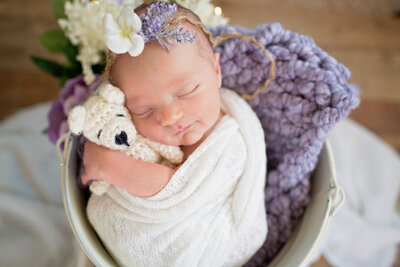 baby-girl-newborn-baby-holding-a-teddy-bear