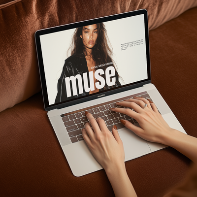 Hands designing a website on a laptop, showcasing Muse Studio’s expertise in responsive web design, branding, and user experience optimization for businesses.
