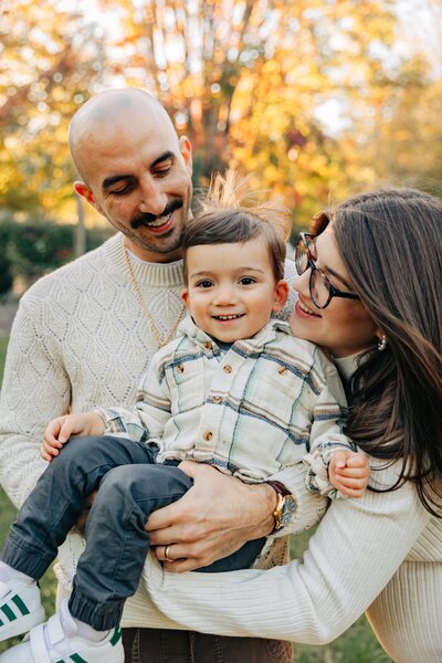 Fall Family Photos with Asheville Motherhood Photographer photographs mom, dad and baby in the fall colors in Hendersonville, NC