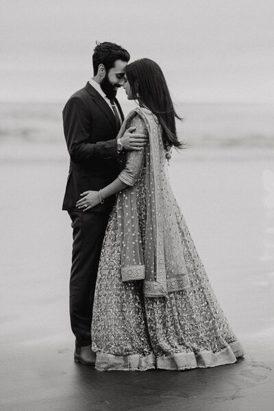 Engagement photography at Auckland's Muriwai Beach with a beautiful Indian couple