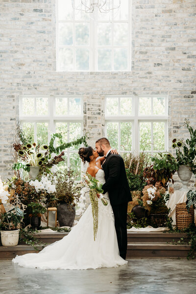 Stylish couple captured in an elegant, editorial-inspired wedding portrait