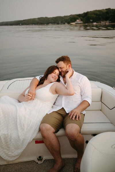 Couples session in field at sunset