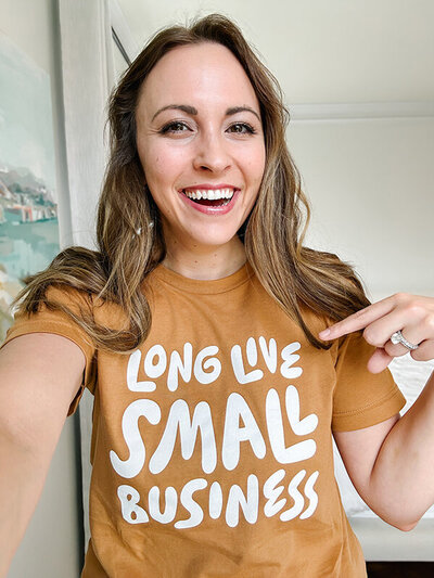 Natalie Franke wearing an orange-yellow shirt saying Long Live Small Business