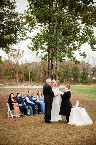 Couple sharing vows with their guests seated around them in Murfreesboro Tennessee