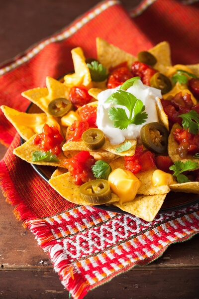 Loaded nachos with salsa and cheese