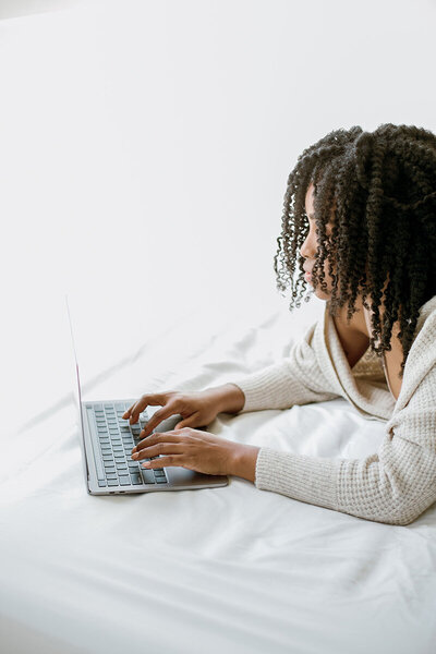 black mother on laptop