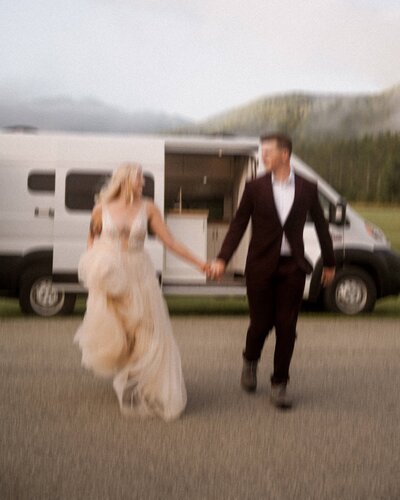 Running towards the mountains after getting ready for a Lake Placid elopement.