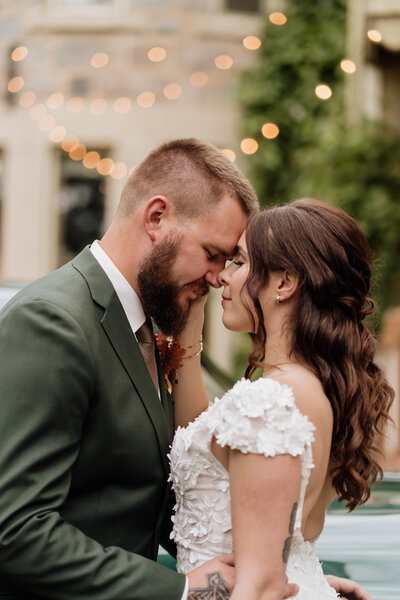 Bride and groom snuggle, taken by Winnipeg wedding photographer