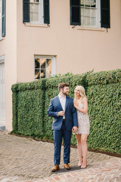 couple smiling at each other during engagement session