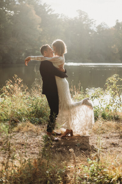 Couple kissing near a lake