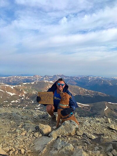 Therapist & Dog on top of Mountain