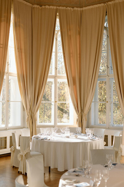 Luxury wedding in Europe – sophisticated bride in a modern wedding gown and groom in a timeless suit.