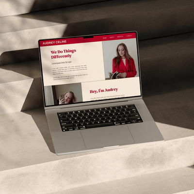 A screenshot of a coaching services landing page featuring the name "Audrey Celine." The page includes a call to action button labeled "I'M SO IN," a section titled "We Do Things Differently," and a section about the services offered. The background includes a motivational quote and a list of sweet treats.
