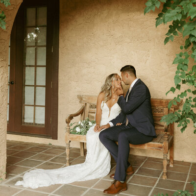 The bride and groom took a private moment on their Tuscan Italian wedding day. The arches and terracotta buildings make Villa Parker feel straight out of Italy.
