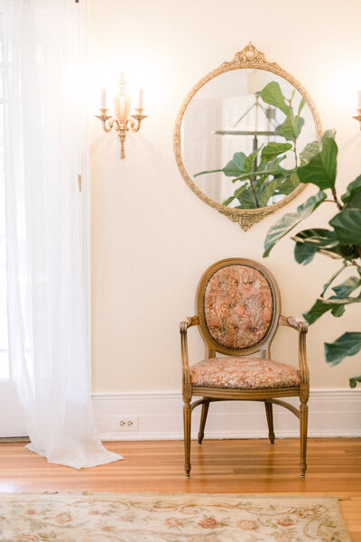 Antique chair and mirror in light-filled room
