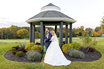 bride and groom in sunflowers at Dyments Glen Drummond Farm